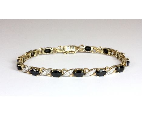 A 9ct gold sapphire and diamond set bracelet
