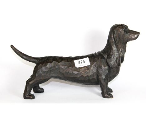 An unusual bronzed ceramic figure of a dog, L 33cm H 19cm