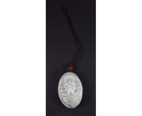 A Chinese pebble jade amulet decorated with a bearded sage with a fan, L 6cm