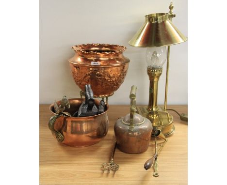 A brass desk lamp and other metal items
