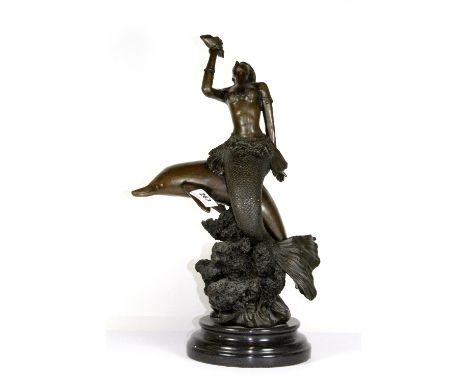 A bronze figure of a mermaid and dolphin, H 44cm