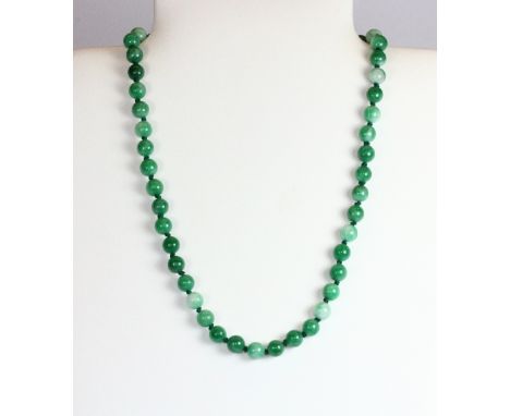 A single strand necklace of 8mm jade beads