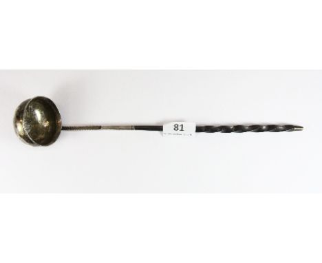 A Georgian white metal toddy ladle inset with a silver coin dated 1772