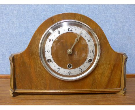 A walnut mantel clock