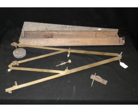 Heath & Wing, London: A brass Pantograph on turned ivory wheels in oak case