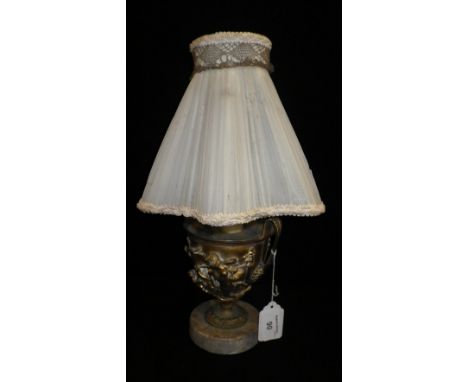 A gilt metal classically inspired urn converted to a table lamp