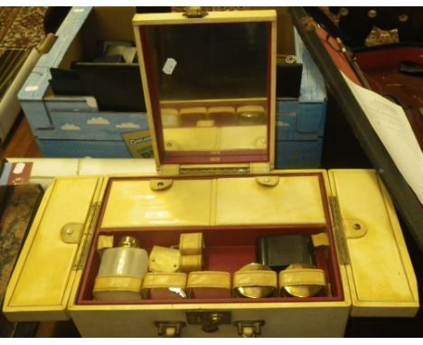 A vintage genuine 'Rawhide' portable dressing set containing a brush set and sundry items