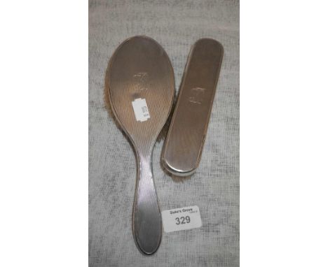 A modern London silver engine-turned dressing table brush and clothes brush with engraved initials 'KJ' (2)