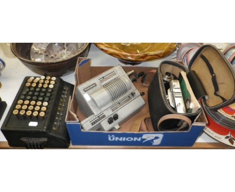 A Vitessa vintage camera and two vintage adding machines