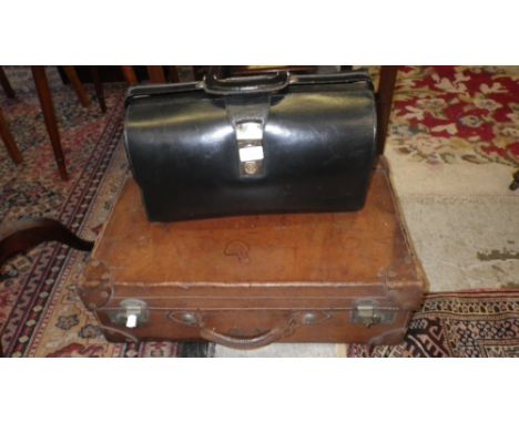 A vintage leather suitcase and a black leather briefcase (2)