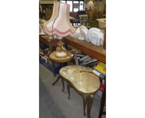 A gilt metal and marble table lamp, decorated with dolphins, a similar tripod table and a nest of three kidney-shaped tables