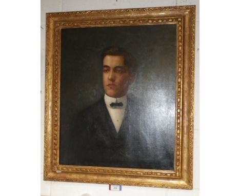 An early 20th century portrait of a young man, signed F Finck, dated 1904, in a gilt frame