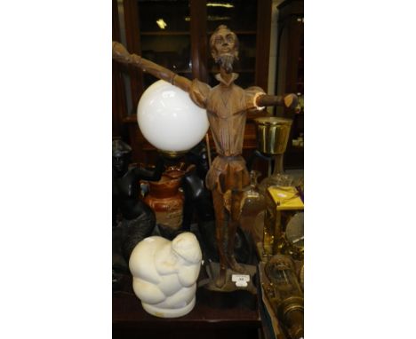 A pair of cast mermaid table lamps, a carved wooden figure and a Ricardo Mesa ceramic study of a large woman 