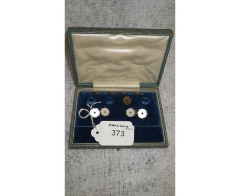 A pair of 18ct and 9ct yellow and white gold cufflinks with mother-of-pearl and sapphire set centres in a fitted case