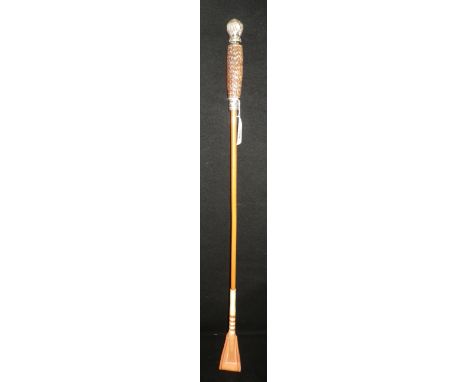 A riding whip with silver mounted horn handle
