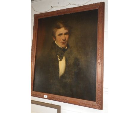 A 19th century half-length portrait of a gentleman, oil on canvas in a carved hardwood frame
