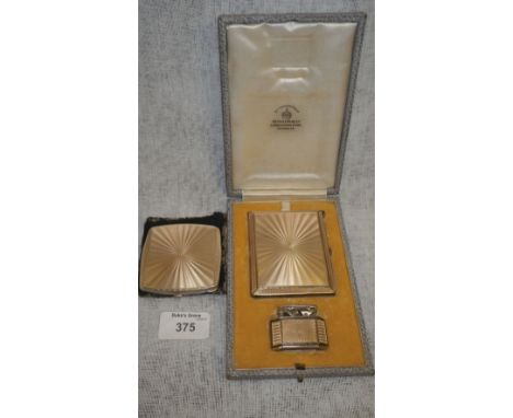 A Mappin & Webb silver, silver gilt and champagne guilloche enamel cigarette case and a matching lighter ensuite in the origi