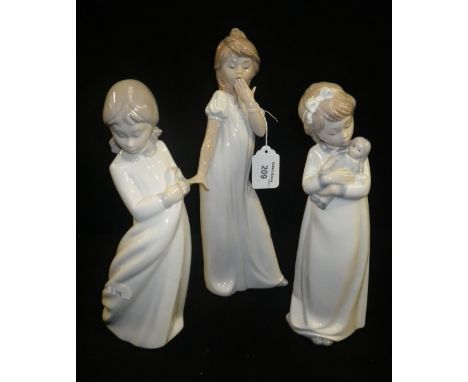 Three Nao ornaments of young girls