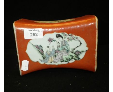 A Chinese ceramic neck rest
