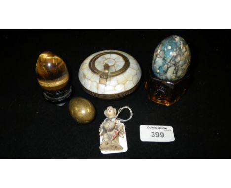 A Netsuke type figure, a 'Tiger's Eye' egg and other similar items