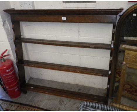 A reproduction oak wall shelf