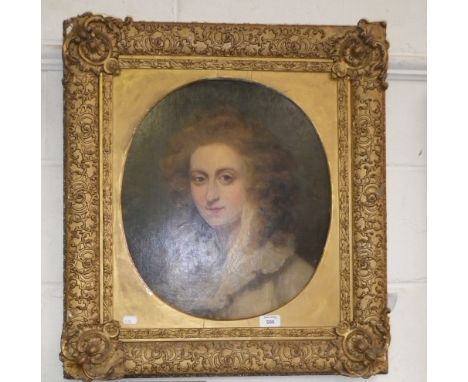 An 18th century style portrait of a woman with lace collar in an oval mount within a gilt frame
