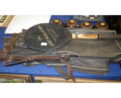 A set of four vintage bowling woods, a set of vintage golf clubs in leather trimmed case and a tennis racket