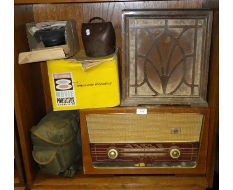 A vintage radio, a speaker, a gas mask and similar items