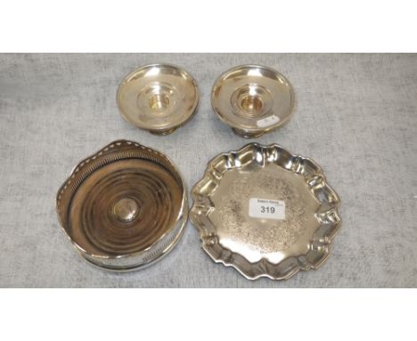 A sterling silver George III style waiter, a white metal decanter stand and another loaded silver item