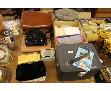A quantity of various textiles; ladies evening purses etc. 