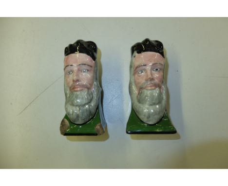 A pair of Georgian pottery sash window stops in the form of  bearded gentelmen