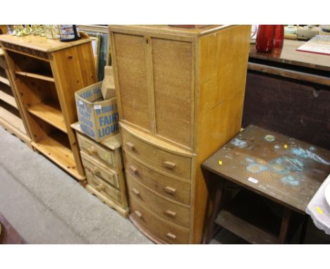 A light oak veneered bureau fitted four drawers below 