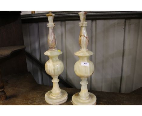 A pair of tall onyx table lamp bases 