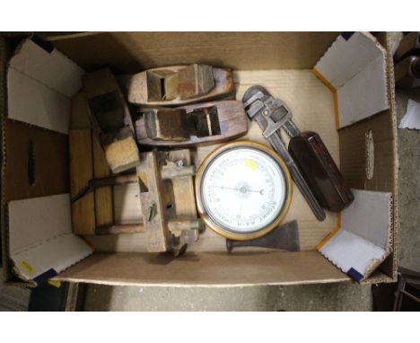A box containing a barometer, wood working planes etc. 