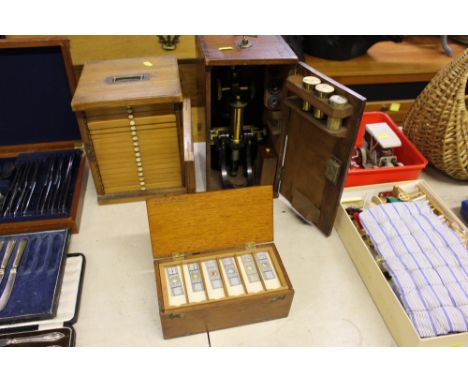 A brass microscope by J Swift of London with accessories contained in carrying case; together with a wooden box containing ap