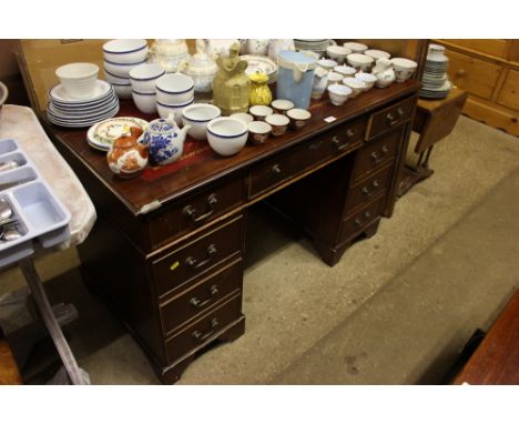 A reproduction mahogany twin pedestal writing desk 