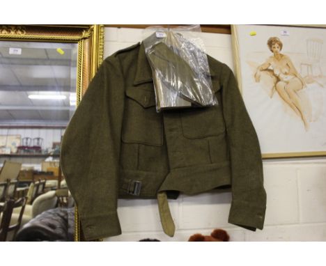 A WW2 1940 patent battle dress blouse with soldiers side hat, service and pay books etc. 