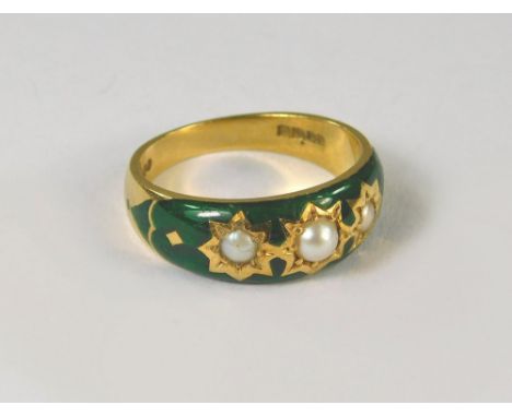 GOLD RING. An 18ct. gold ring, the front green enamelled &amp; set with three half pearls. London 1974. Size N. Approx. 6g.