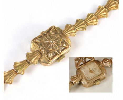 COCKTAIL WATCH. A lady's 9ct. gold cased, 1950's cocktail watch, by Olma, with hinged pierced cover over the dial. Fitted a 9