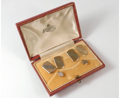 CUFFLINK/STUD SET. A pair of 9ct. white &amp; yellow gold, engine turned cufflinks &amp; a pair of matching studs in fitted c