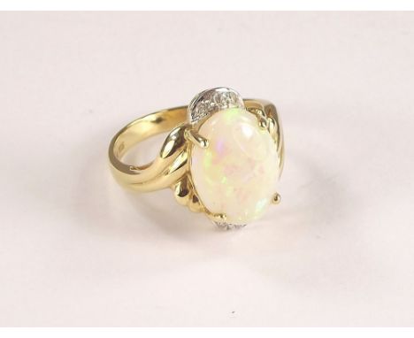 OPAL RING. A 14ct. gold opal ring, the large opal flanked with six diamonds. Size O/P.