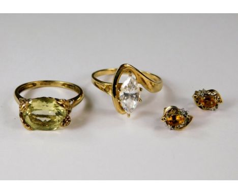 RINGS ETC. A 14ct. gold dress ring, set a marquise cubic zirconia, a 9ct. gold dress ring &amp; a pair of stud earrings.