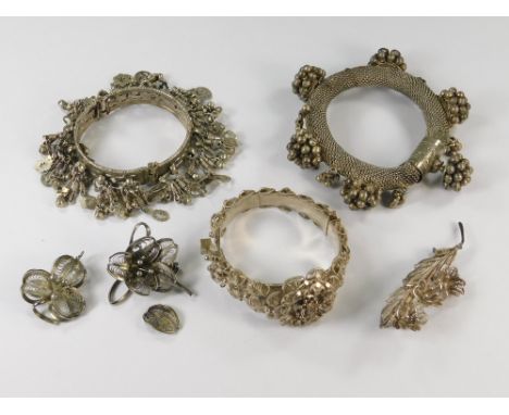SILVER FILIGREE ETC.A silver filigree hinged bangle, other silver filigree jewellery & two ethnic bangles.