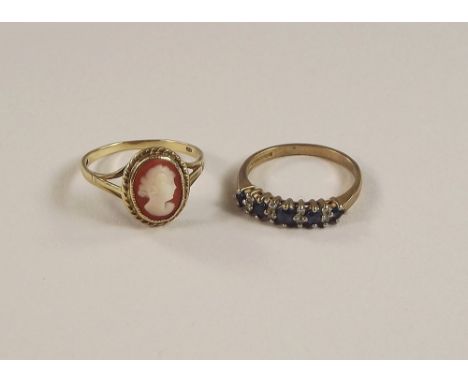 DRESS RINGS. A modern 9ct. gold cameo dress ring &amp; a 9ct. gold sapphire, half hoop ring.