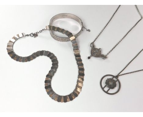 SILVER PENDANTS ETC.A Scottish silver & moss agate pendant by J v B, a silver & amethyst pendant, a silver textured necklace 