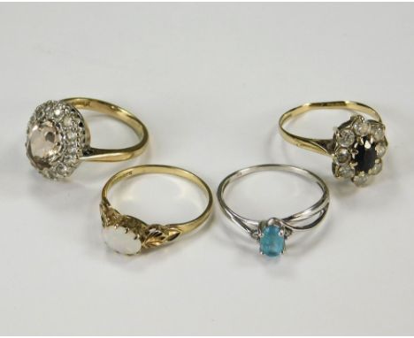 DRESS RINGS. A 9ct. opal set dress ring &amp; three other gold dress rings. Approx. 8.2g.