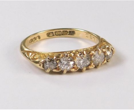 GOLD RING. An 18ct. gold, five stone diamond ring. Birmingham 1910.