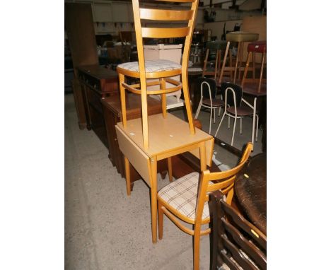 small drop leafed table and 2 chairs