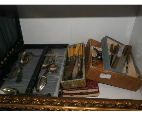 shelf of boxed flatware