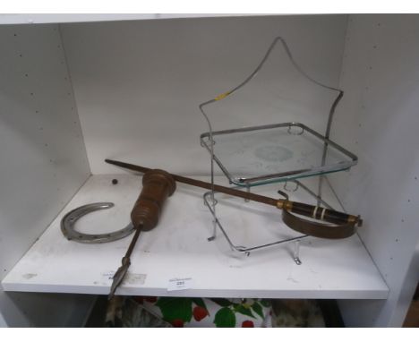 shelf of metalware including cakestand